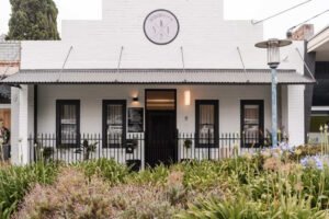 Close-up of a facial massage treatment focused on jaw and cheek area, representing emotional release through bodywork