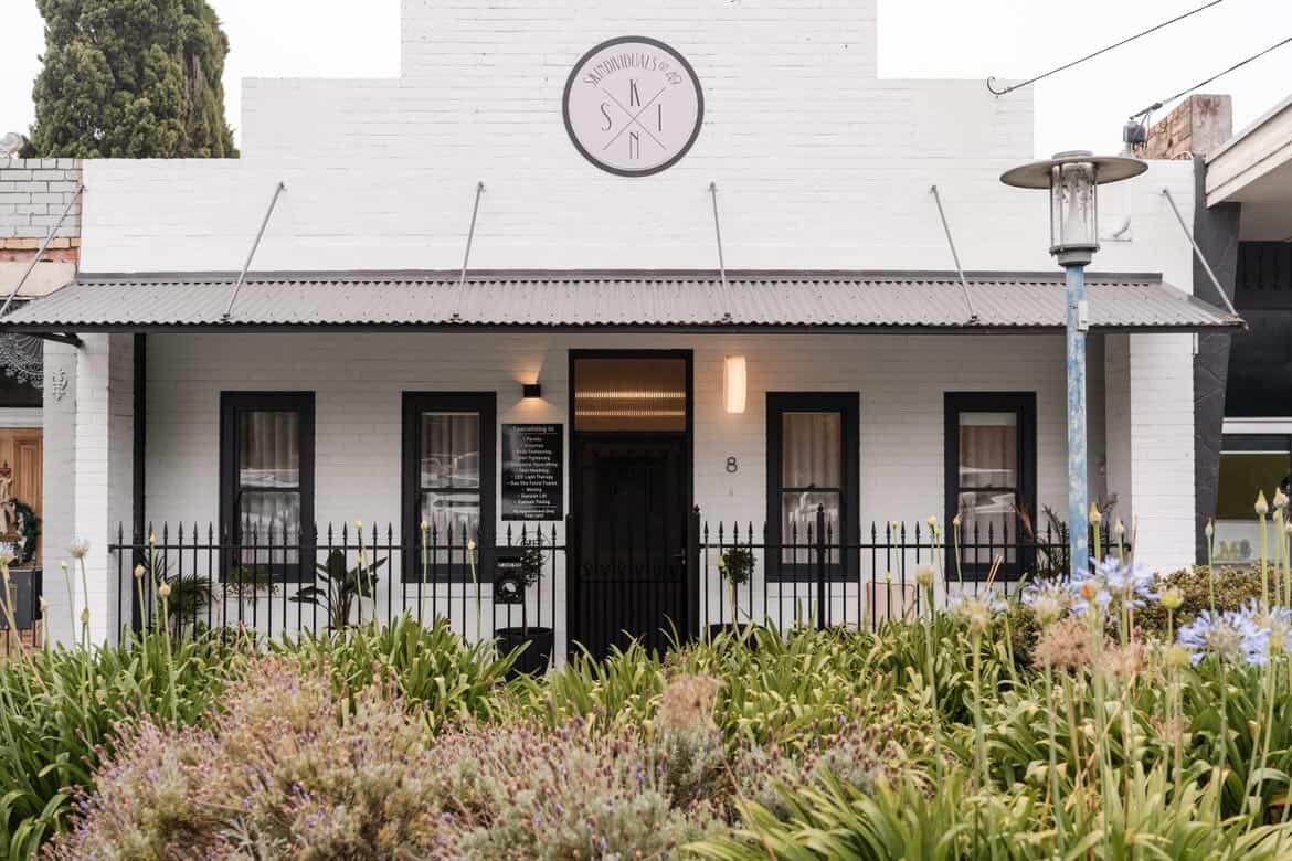 Close-up of a facial massage treatment focused on jaw and cheek area, representing emotional release through bodywork